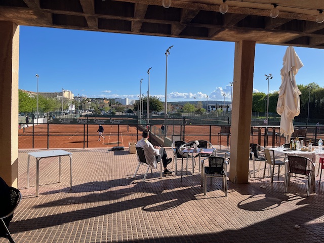 The dining area with a great view of the tennis courts.
